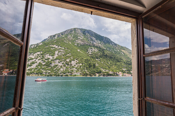 Boat travels along the Bay of Kotor Picture Board by Jason Wells