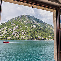 Buy canvas prints of Boat travels along the Bay of Kotor by Jason Wells