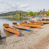 Buy canvas prints of Wooden rowing boats on the shores at Ambleside by Jason Wells