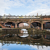 Buy canvas prints of Tram crossing the Bridgewater Canal by Jason Wells
