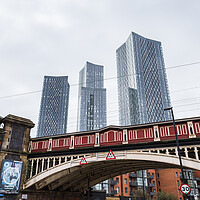 Buy canvas prints of Deansgate Square above a red railway bridge by Jason Wells