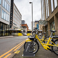 Buy canvas prints of Yellow cycles for hire in Manchester by Jason Wells