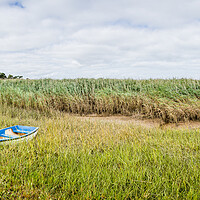 Buy canvas prints of Lone boat at Brancaster Staithe by Jason Wells