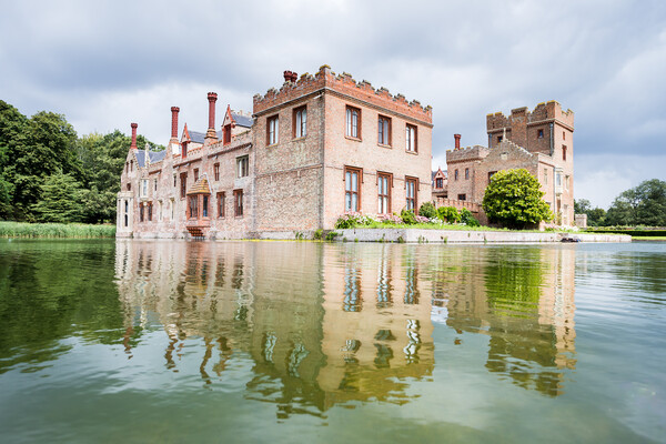 Oxburgh Hall reflecting in a moat Picture Board by Jason Wells