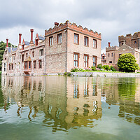 Buy canvas prints of Oxburgh Hall reflecting in a moat by Jason Wells