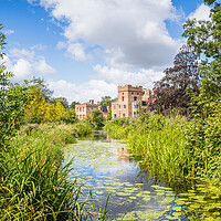 Buy canvas prints of Oxborough Hall over a channel of water by Jason Wells