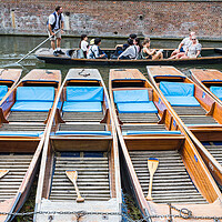 Buy canvas prints of Tourists pass a row of punts by Jason Wells