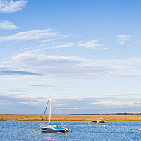 Buy canvas prints of Boats lit up at high tide by Jason Wells