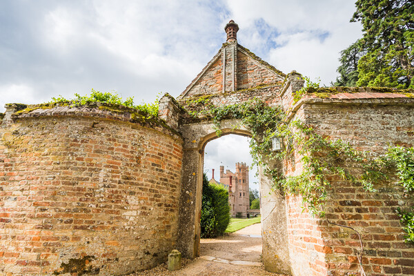 Oxburgh Hall through an arch Picture Board by Jason Wells