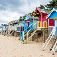 Buy canvas prints of Beautifully coloured beach huts at Wells by Jason Wells