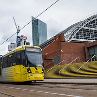 Buy canvas prints of Yellow tram passing the Manchester Central Convention Complex by Jason Wells