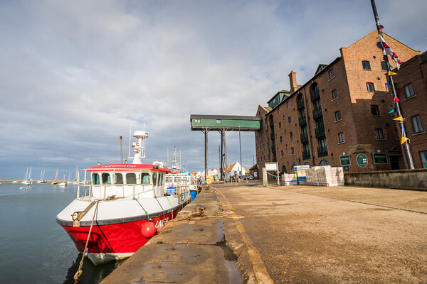Fishing boat in Wells next the Sea harbour Framed Print by Jason Wells