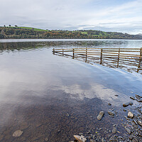 Buy canvas prints of Fence dips into Lake Bala by Jason Wells