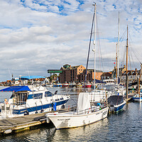 Buy canvas prints of Boats in Wells next the Sea harbour by Jason Wells