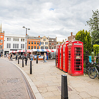 Buy canvas prints of Red phone boxes next to Cambridge market by Jason Wells