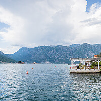 Buy canvas prints of Restaurants line part of the Perast waterfront by Jason Wells