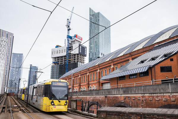 Metrolink tram approaching Manchester city centre Picture Board by Jason Wells