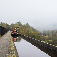 Buy canvas prints of Reflections of a narrow boat on the Pontcysyllte Aqueduct by Jason Wells