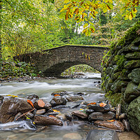 Buy canvas prints of Flowing water under an old bridge by Jason Wells