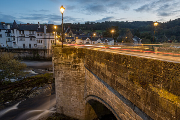 Day turns to night over Llangollen Bridge Picture Board by Jason Wells