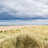 Buy canvas prints of Titchwell beach under a dramatic sky by Jason Wells
