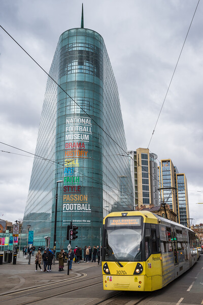 Tram passes the National Football Museum Picture Board by Jason Wells