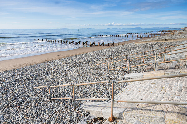Railings and steps lead down to Barmouth beach Picture Board by Jason Wells