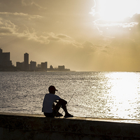 Buy canvas prints of  Boy fishes in Havana by Jason Wells