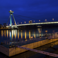 Buy canvas prints of Reflections of the UFO Bridge during the blue hour by Jason Wells