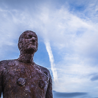 Buy canvas prints of An Iron Man looks out to sea by Jason Wells