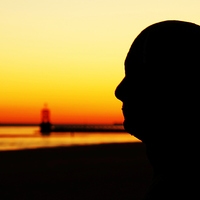 Buy canvas prints of Silhouette of an Iron Man at sunset  by Jason Wells
