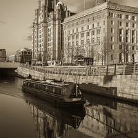 Buy canvas prints of Canal boat in front of the Three Graces by Jason Wells