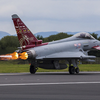 Buy canvas prints of RAF Typhoon powering down the runway by Jason Wells