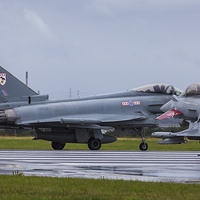 Buy canvas prints of Pair of RAF Typhoons on the runway by Jason Wells