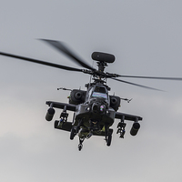 Buy canvas prints of AH-64D Apache hovering in front of the crowd by Jason Wells