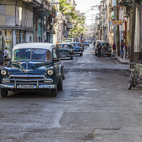 Buy canvas prints of Facing a line of taxi's in Centro Havana by Jason Wells