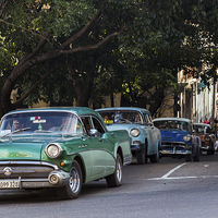 Buy canvas prints of Vintage cars in Havana climbing a hill by Jason Wells