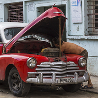 Buy canvas prints of Red vintage car being worked on by Jason Wells
