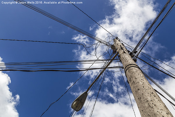 Looking up at a chaotic telegraph pole Picture Board by Jason Wells