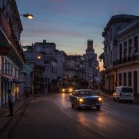 Buy canvas prints of Early morning headlights in Centro Havana by Jason Wells