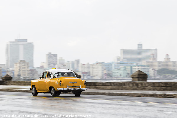 Yellow taxi hurtling down the Malecon Picture Board by Jason Wells