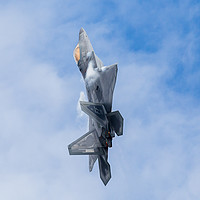 Buy canvas prints of F-22A Raptor climbs into the sky by Jason Wells