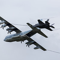 Buy canvas prints of C-130 & F-35 stealth aerial refueling demo by Jason Wells