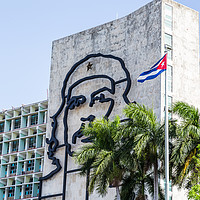Buy canvas prints of Che Guevara next to the Cuban flag by Jason Wells