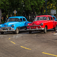 Buy canvas prints of Red & blue old timers turning off by Jason Wells