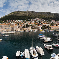 Buy canvas prints of Dubrovnik harbour at the foot of Mount Srd by Jason Wells