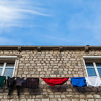 Buy canvas prints of Looking up at laundry on the line by Jason Wells