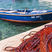 Buy canvas prints of Nets dry out on Kolocep quayside by Jason Wells