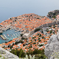 Buy canvas prints of Dubrovnik seen between the rocks on Srd hill by Jason Wells