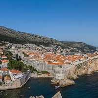 Buy canvas prints of Tourists look out towards the old town of Dubrovni by Jason Wells